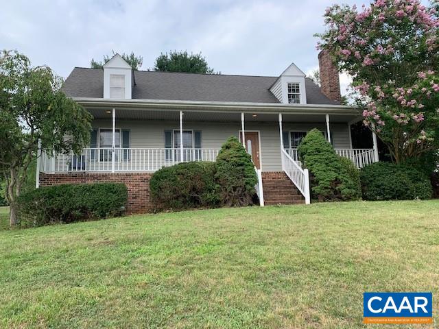 152 Spring Oaks Lane Ruckersville, VA 22968 - Photo 1 of 34 a front view of a house with a garden