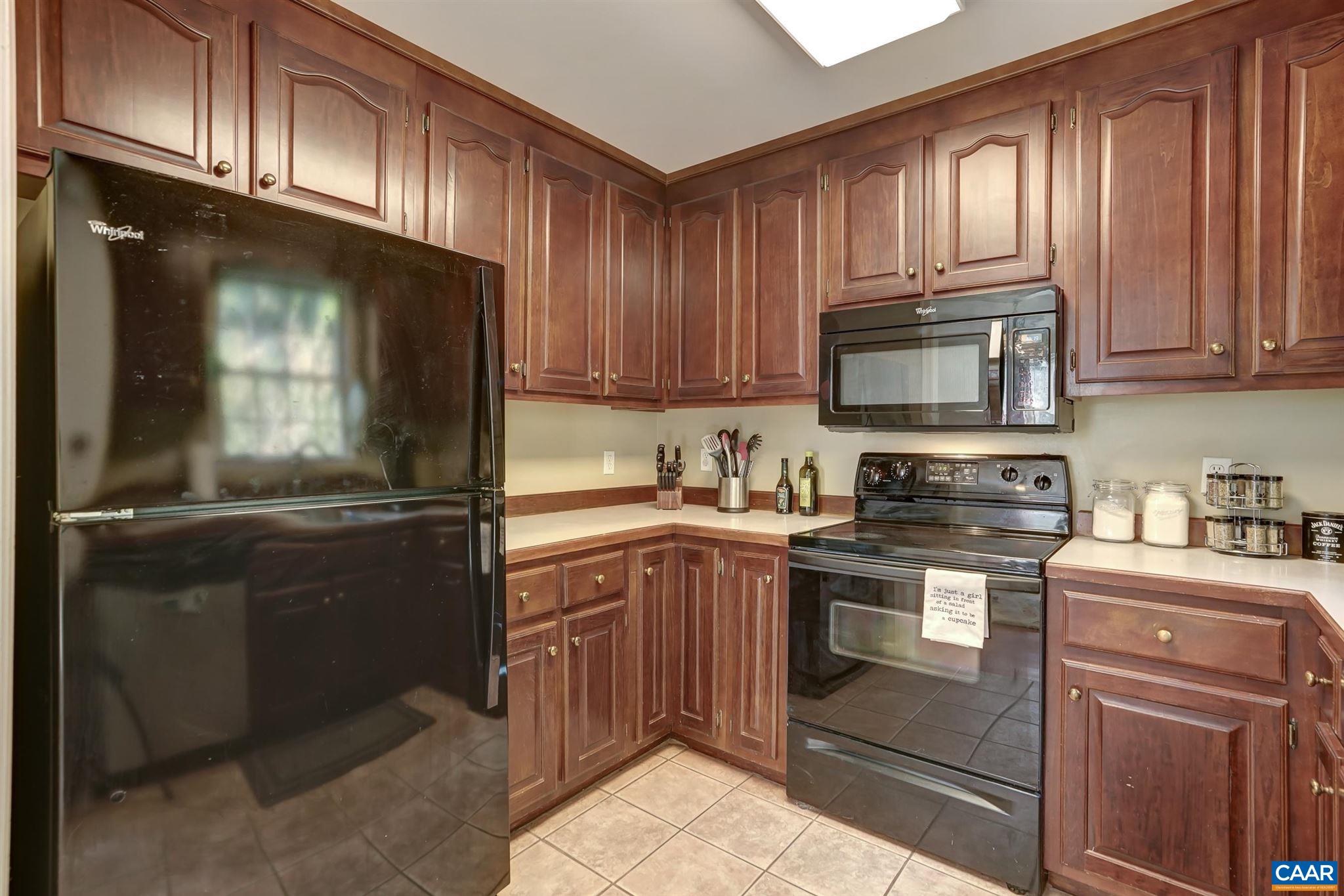 152 Spring Oaks Lane Ruckersville, VA 22968 - Photo 23 of 34 a kitchen with a sink stove and microwave