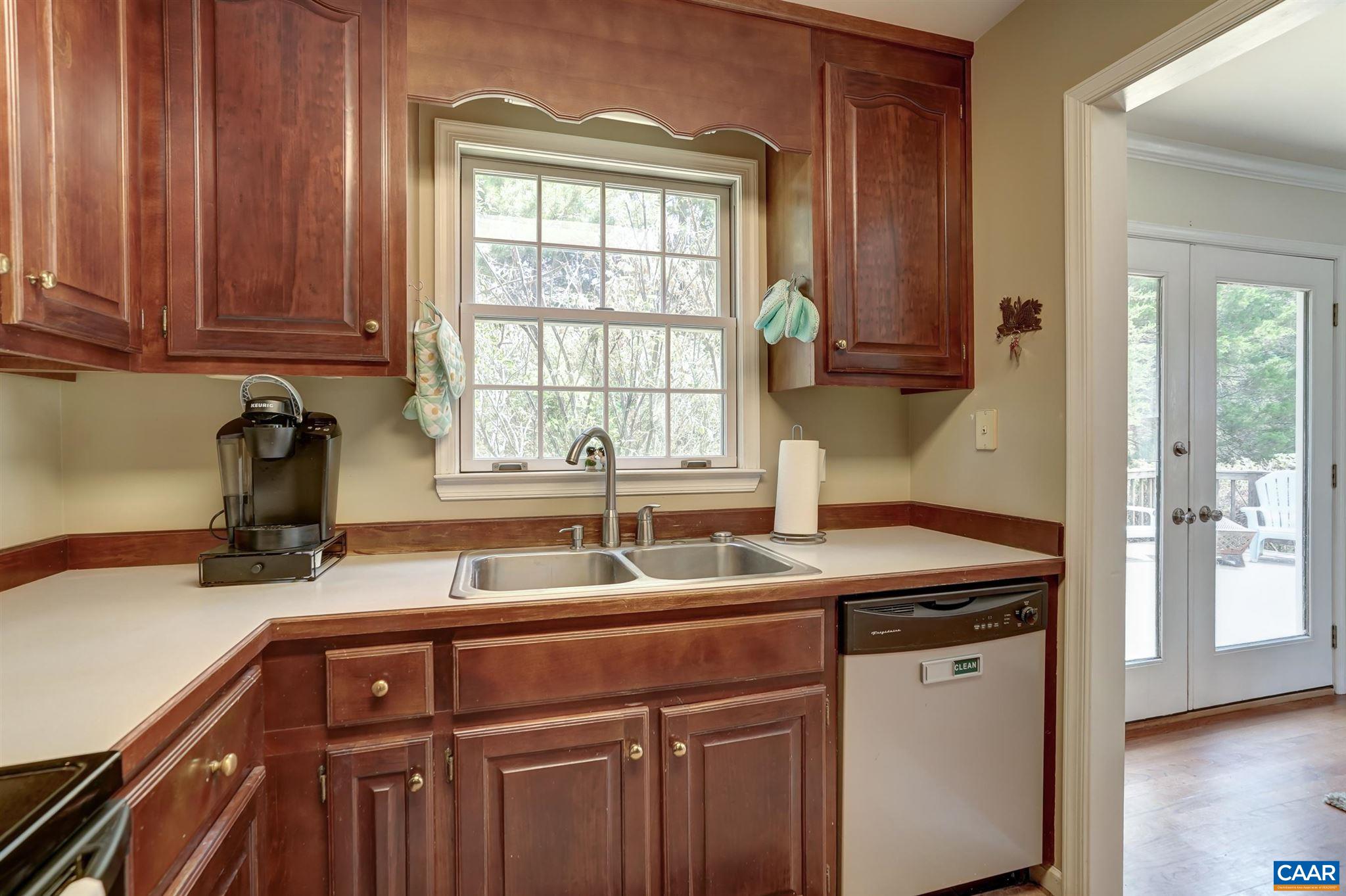 152 Spring Oaks Lane Ruckersville, VA 22968 - Photo 24 of 34 a kitchen with a sink and cabinets