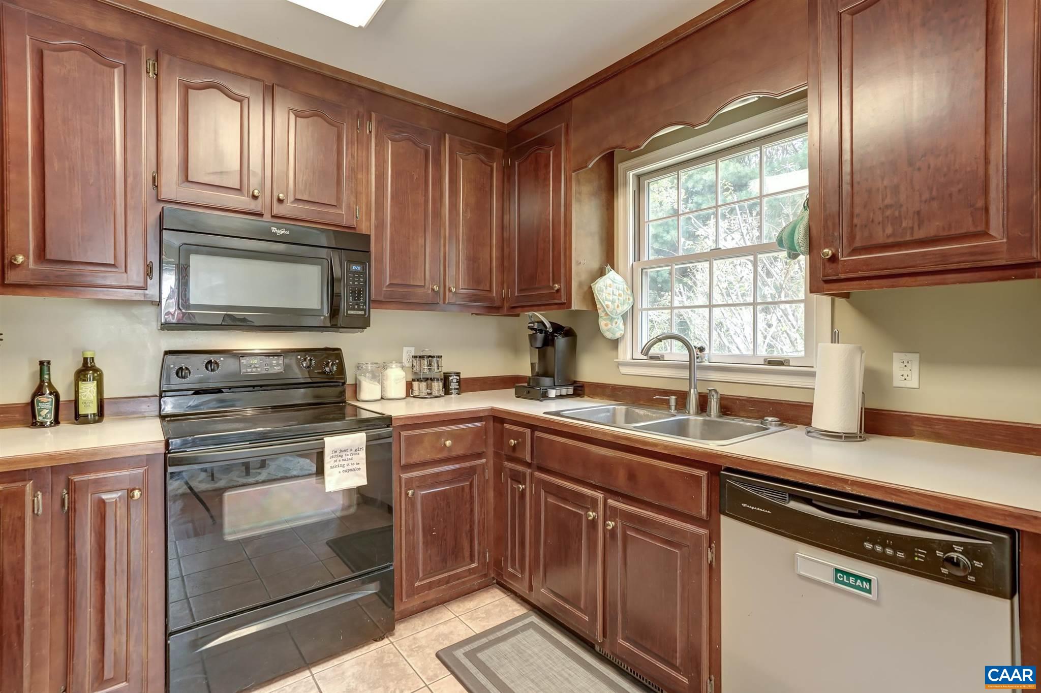 152 Spring Oaks Lane Ruckersville, VA 22968 - Photo 25 of 34 a kitchen with granite countertop a sink stainless steel appliances and cabinets