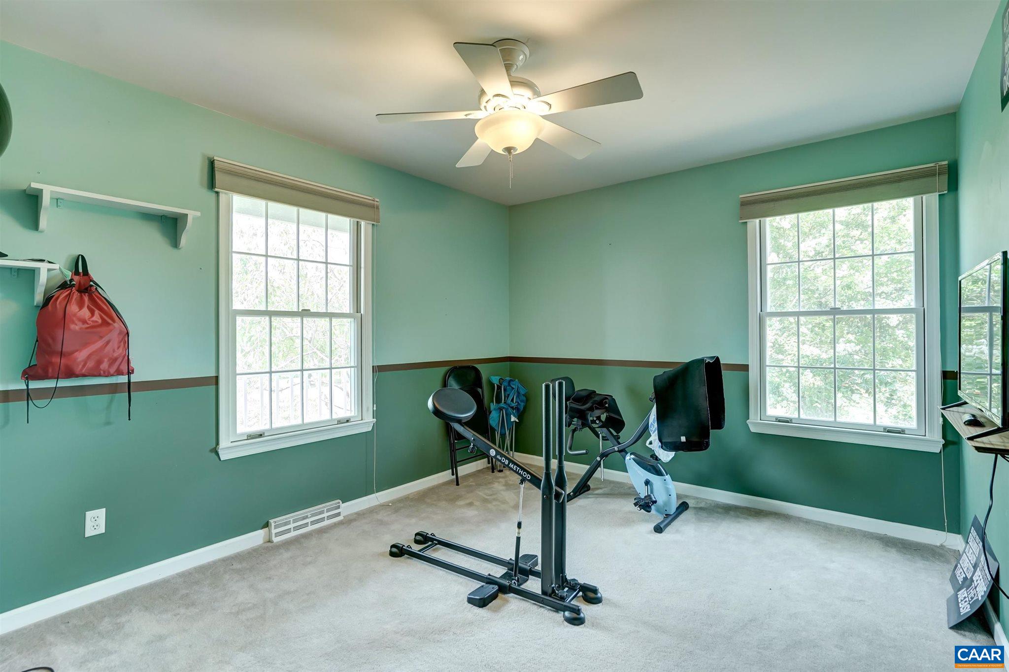 152 Spring Oaks Lane Ruckersville, VA 22968 - Photo 32 of 34 a view of a room with gym equipment and windows