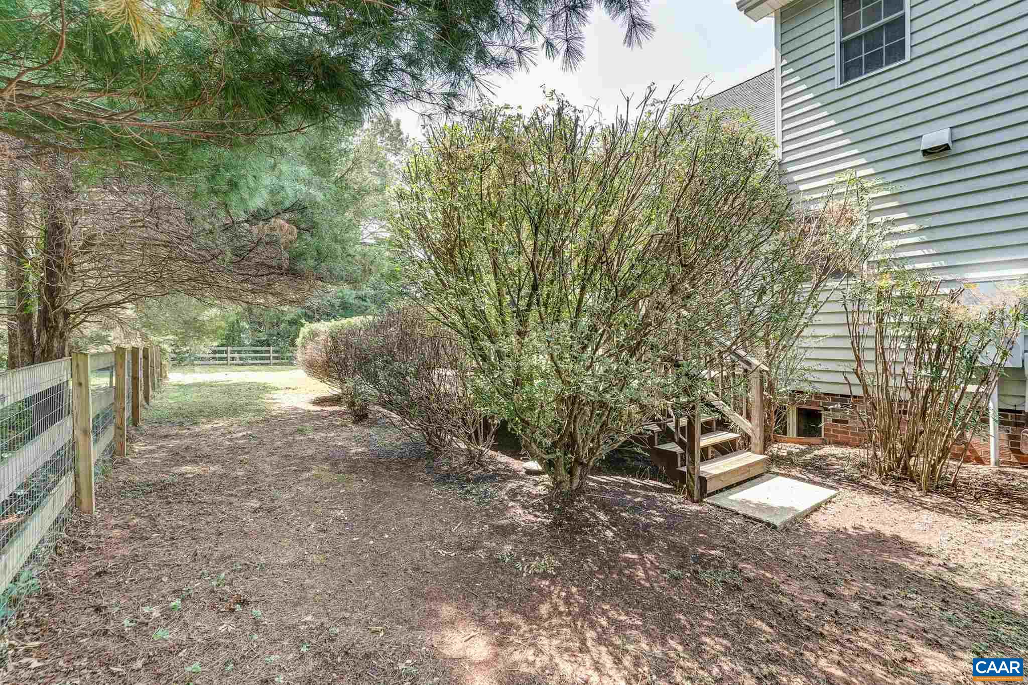 152 Spring Oaks Lane Ruckersville, VA 22968 - Photo 6 of 34 a view of a yard with plants and trees