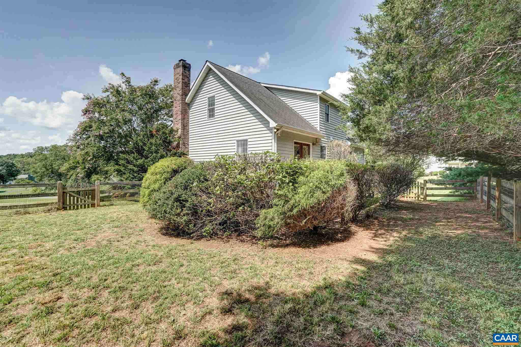 152 Spring Oaks Lane Ruckersville, VA 22968 - Photo 7 of 34 a view of backyard of house and trees all around