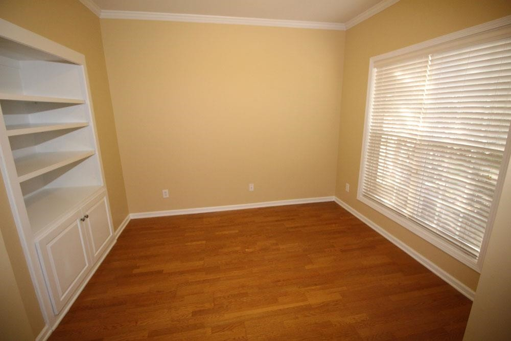 6952 Middleboro Drive Raleigh, NC 27612 - Photo 2 of 32 Living Room/Study/Office with built-ins and crown moulding. Living Room/Study/Office