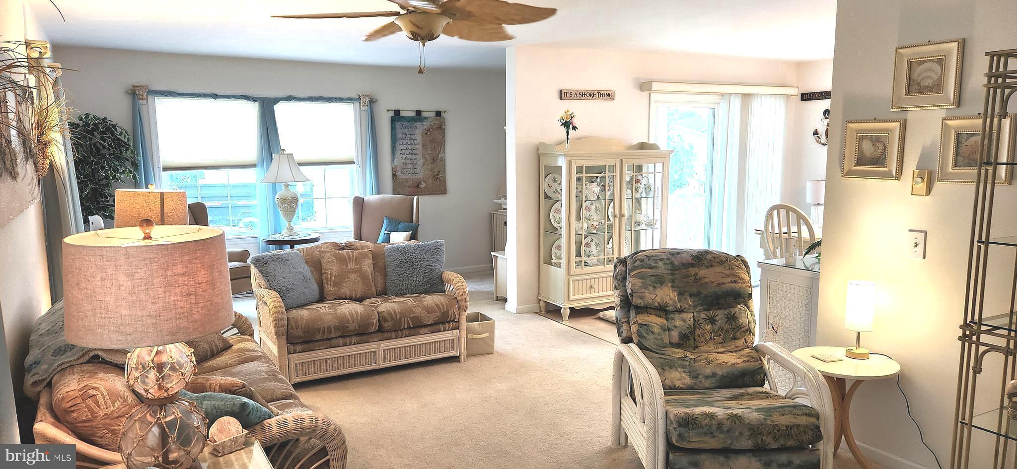 13322 Peachtree Road Ocean City, MD 21842 - Photo 16 of 54 a living room with furniture and a large window