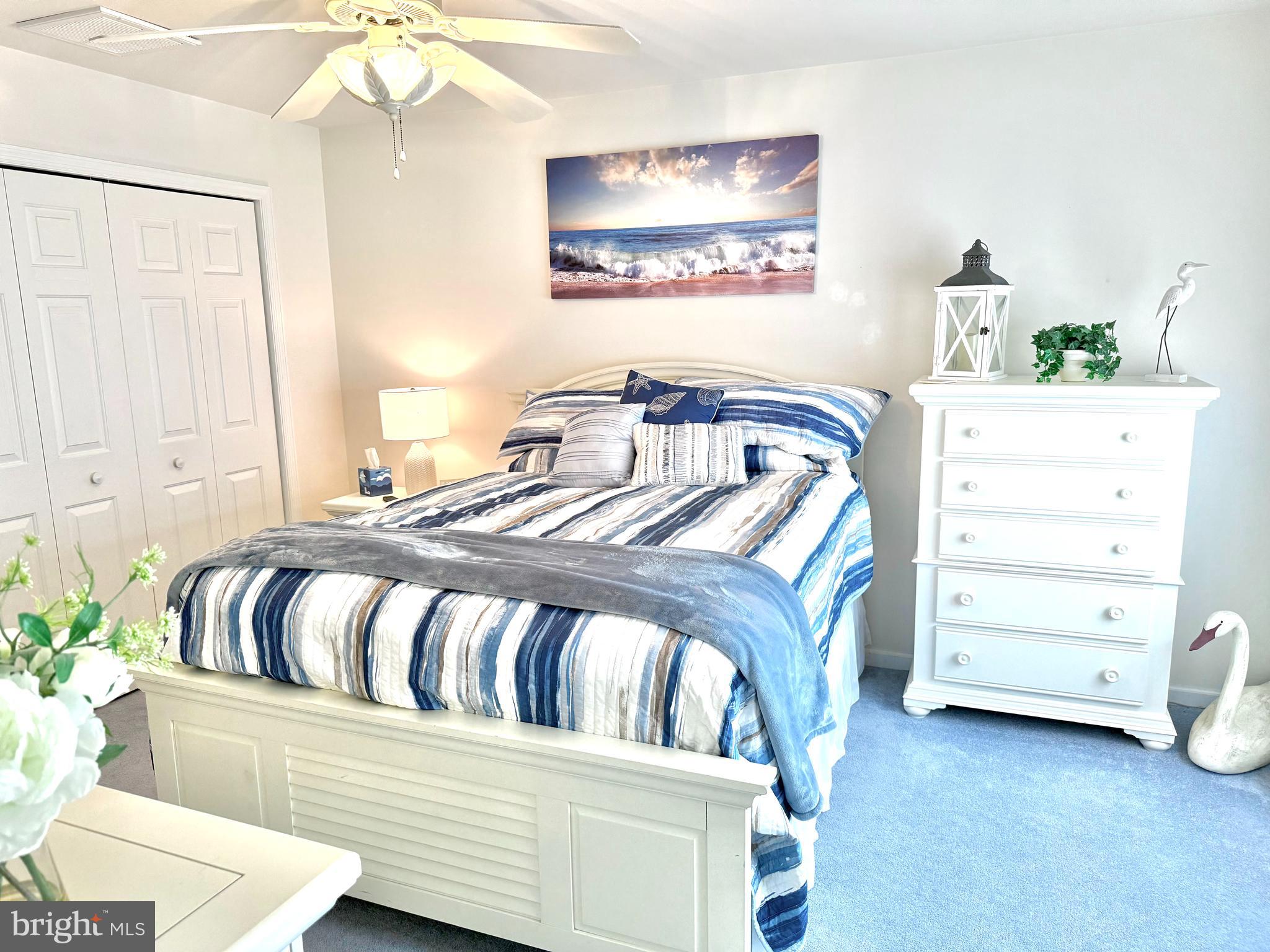 13322 Peachtree Road Ocean City, MD 21842 - Photo 24 of 54 a bedroom with a bed and a dresser