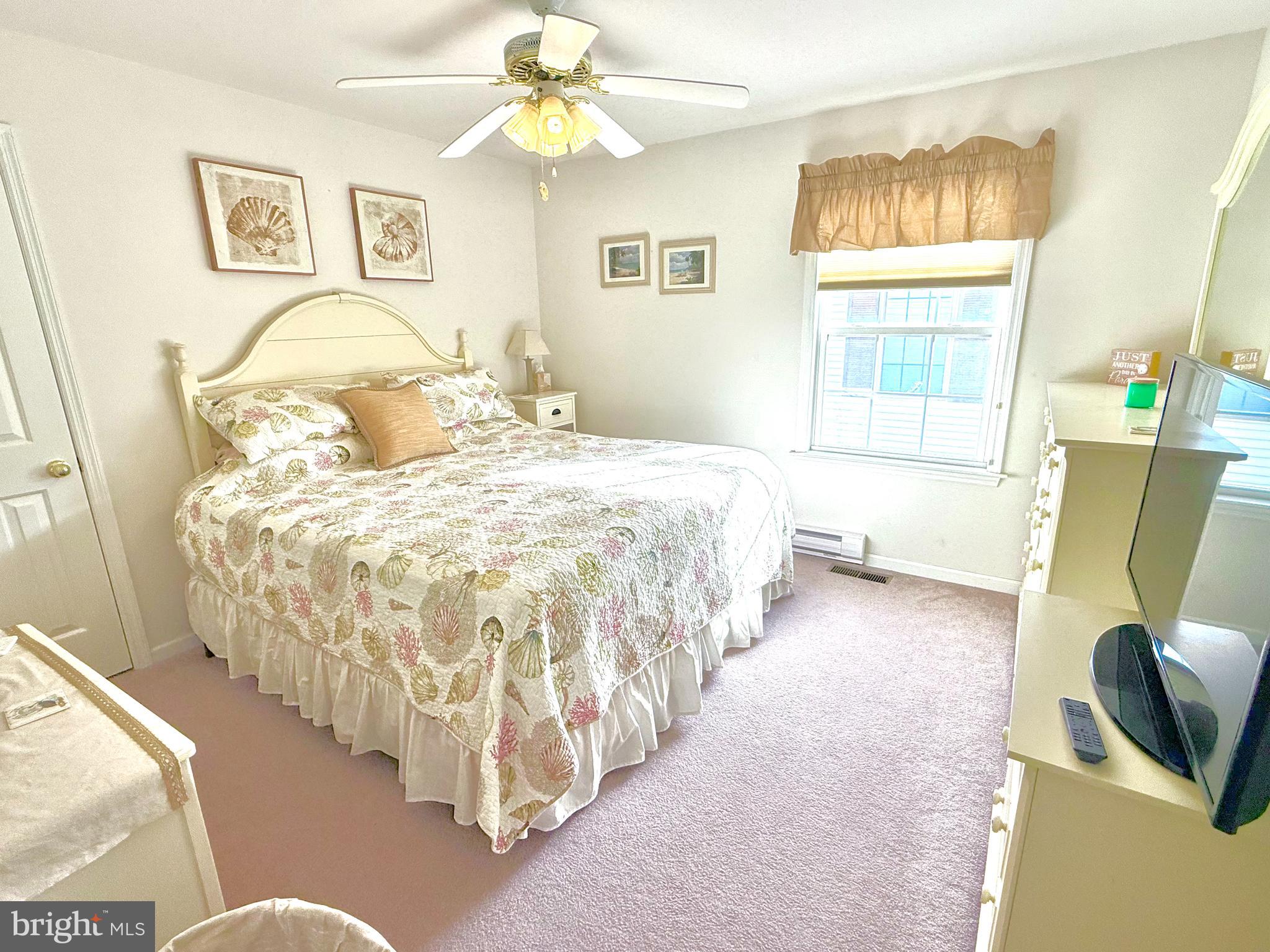 13322 Peachtree Road Ocean City, MD 21842 - Photo 29 of 54 a bed room with a bed and a chair
