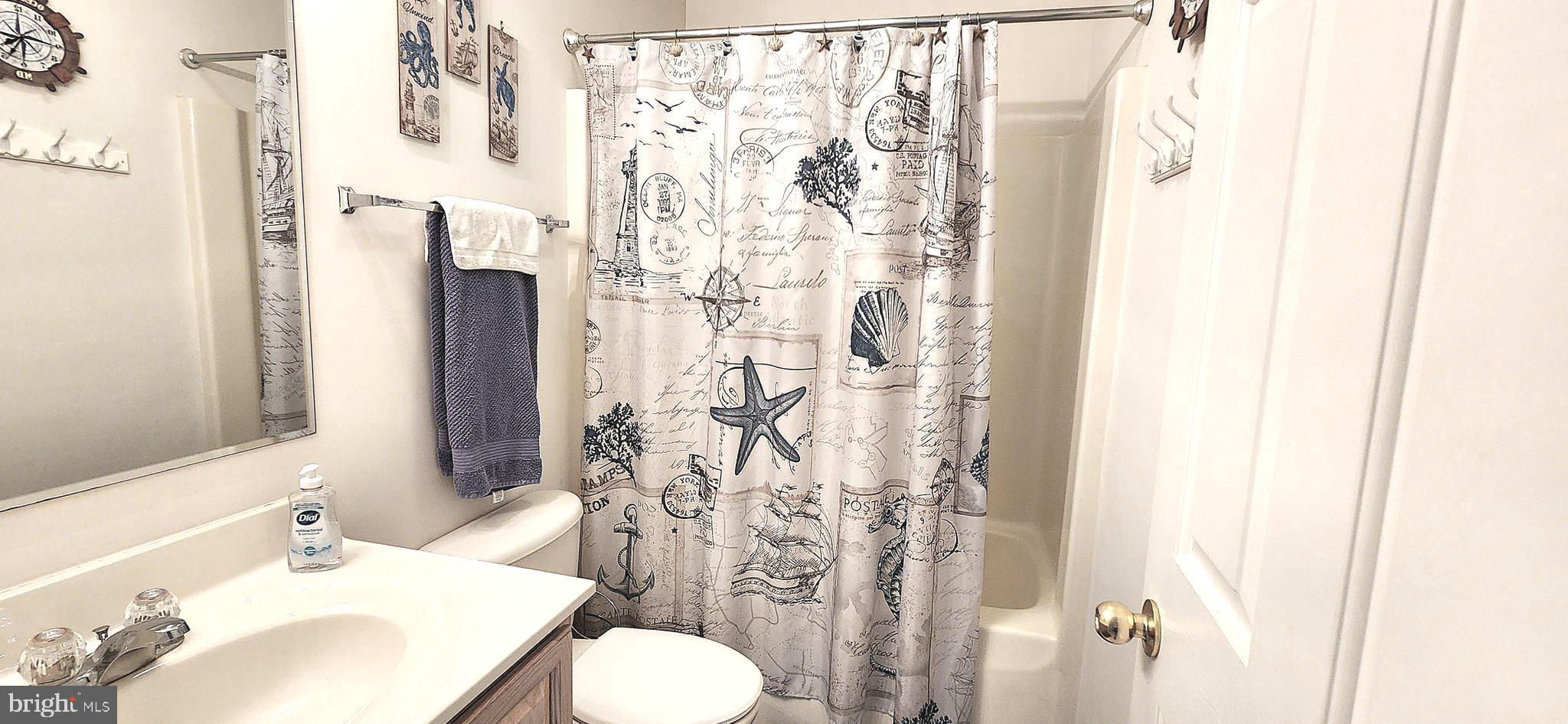 13322 Peachtree Road Ocean City, MD 21842 - Photo 35 of 54 a bathroom with a sink toilet and shower