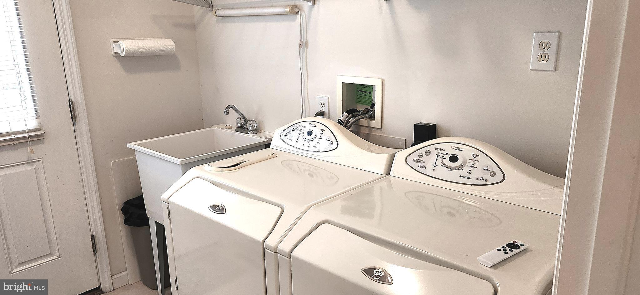 13322 Peachtree Road Ocean City, MD 21842 - Photo 37 of 54 a utility room with dryer and washer