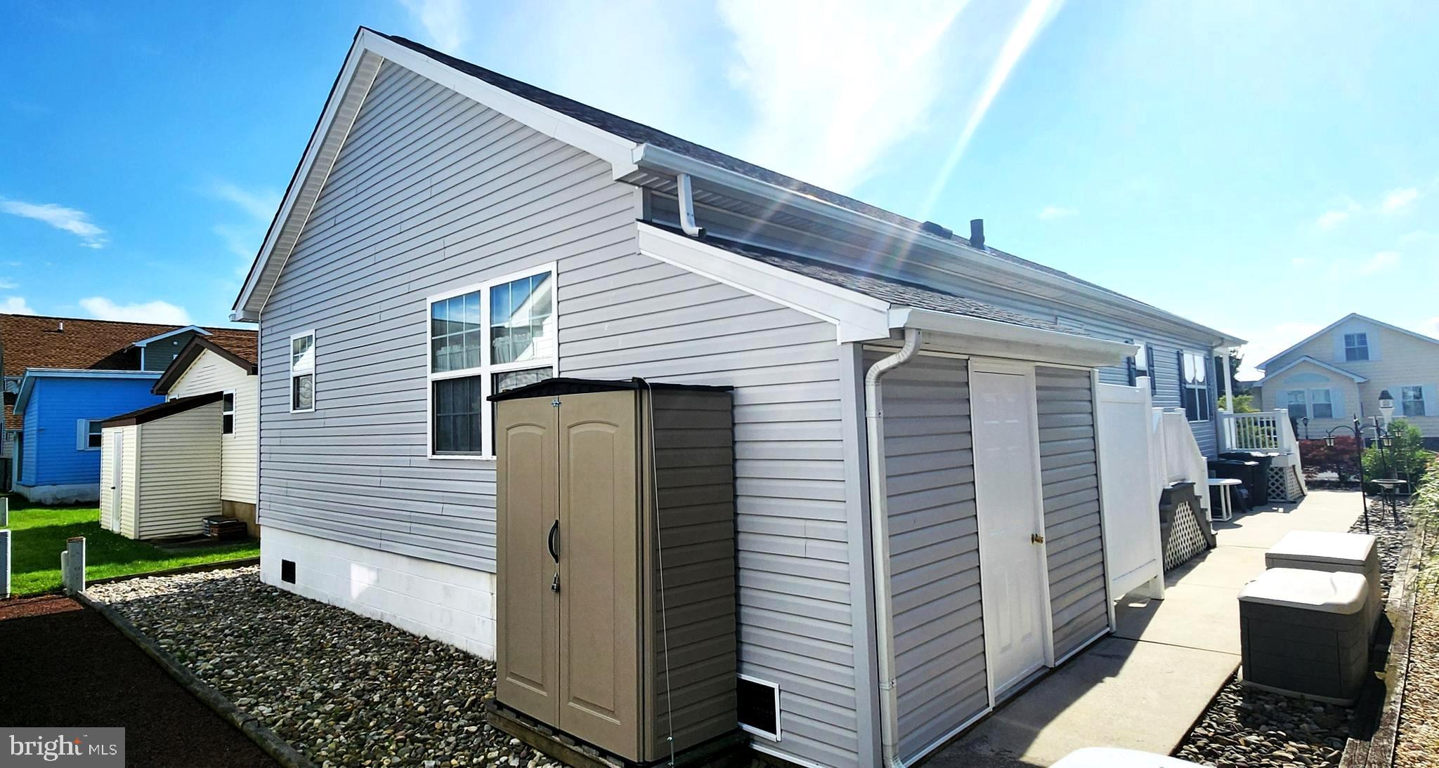 13322 Peachtree Road Ocean City, MD 21842 - Photo 7 of 54 a view of a house with a yard