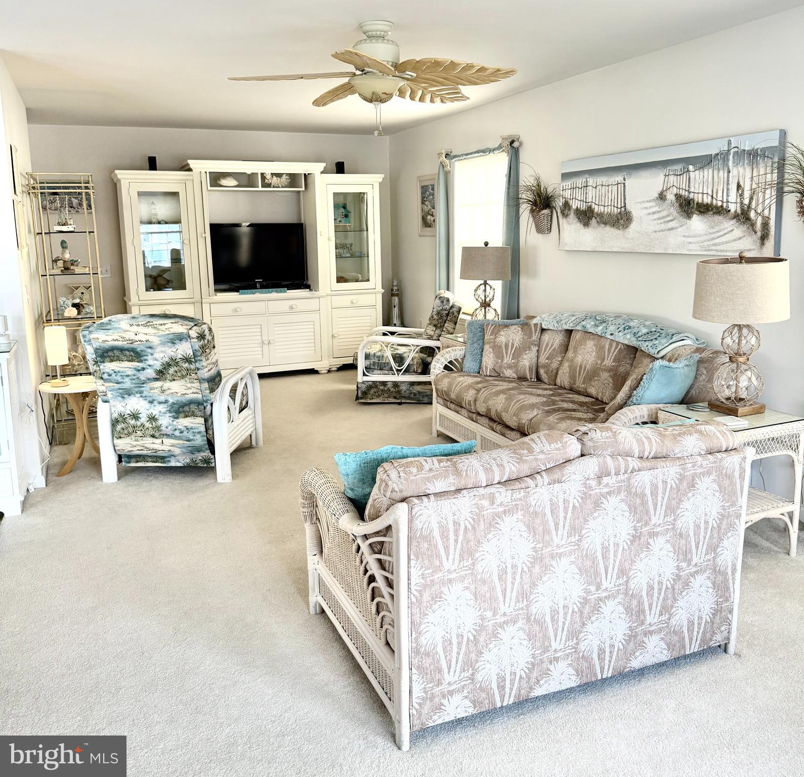 13322 Peachtree Road Ocean City, MD 21842 - Photo 8 of 54 a living room with furniture and flat screen tv