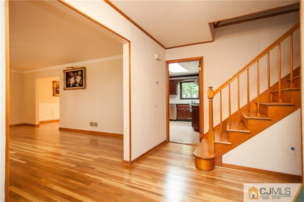 91 George Avenue Edison, NJ 08820 - Photo 2 of 21 a view of an entryway with wooden floor