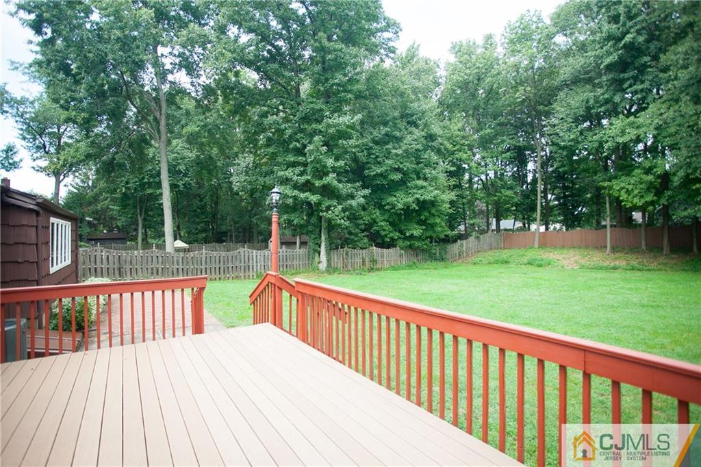91 George Avenue Edison, NJ 08820 - Photo 20 of 21 a view of a deck with a yard