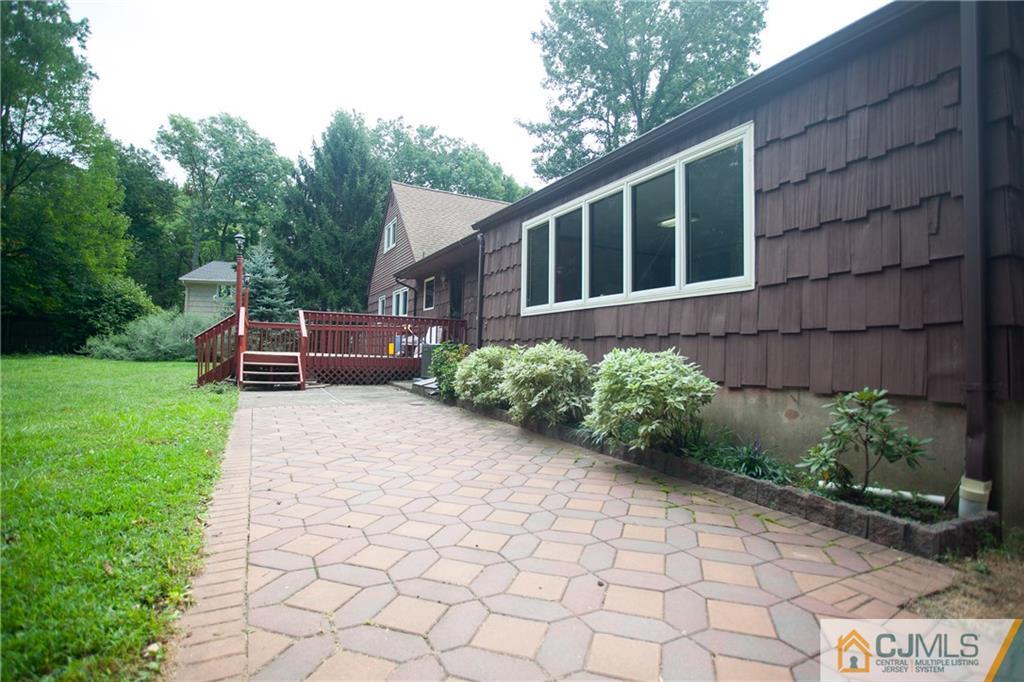 91 George Avenue Edison, NJ 08820 - Photo 21 of 21 a front view of a house with a garden