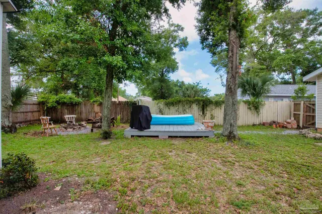 a view of a chair and table of the garden