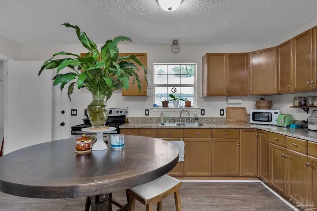 a kitchen with a table and chairs in it