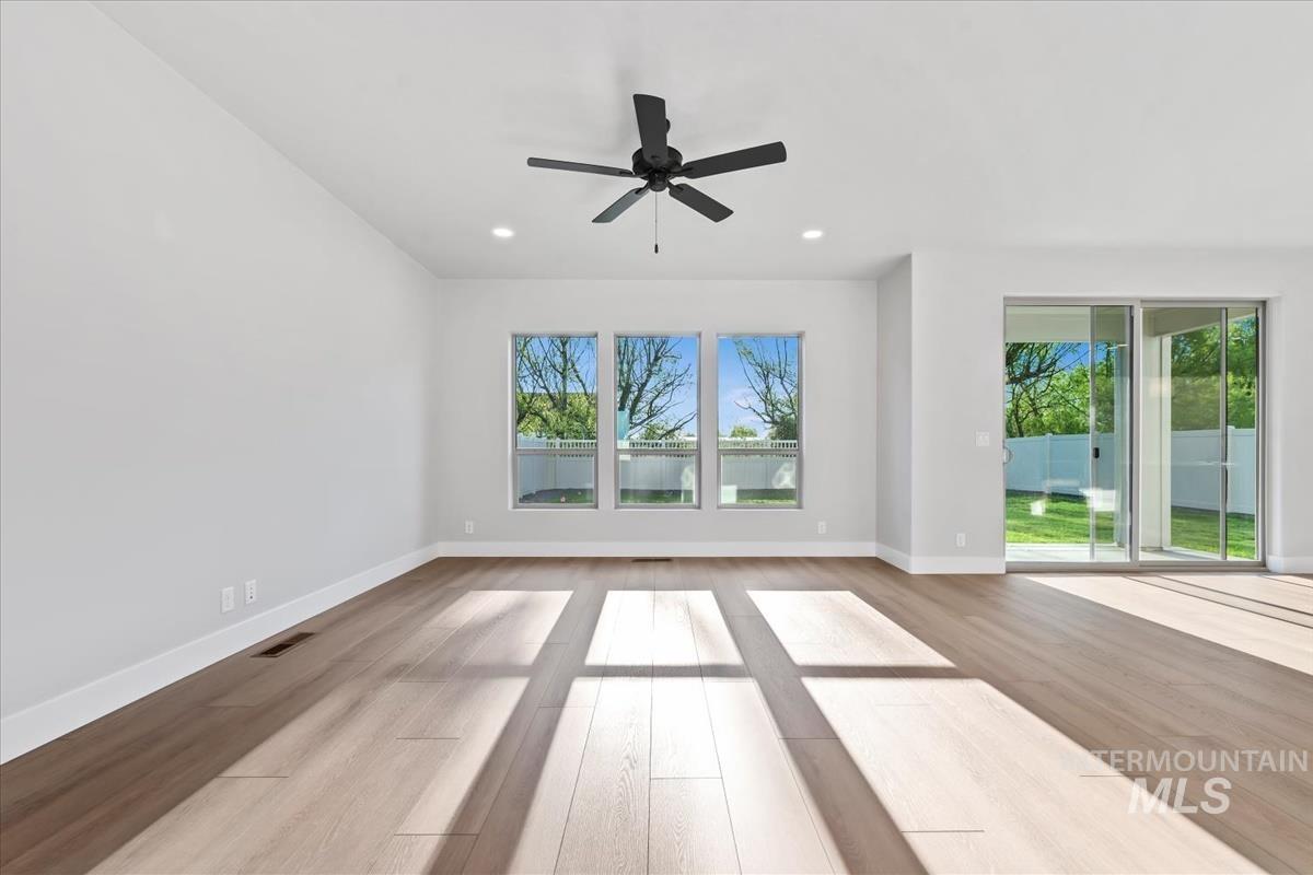 4223 Tropic Way Caldwell, ID 83607 - Photo 15 of 42 Spacious interior featuring light wood-finish flooring, recessed lighting, and a modern ceiling fan