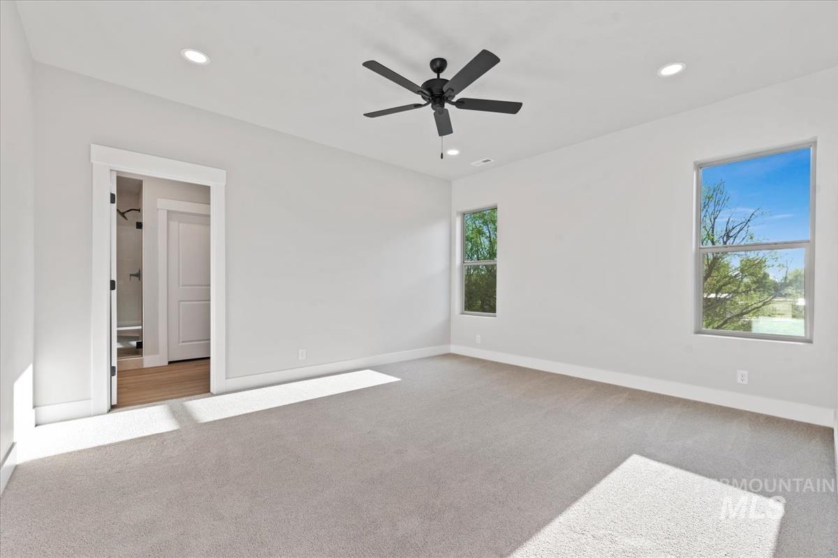 4223 Tropic Way Caldwell, ID 83607 - Photo 20 of 42 Spacious room with light gray carpet and white walls