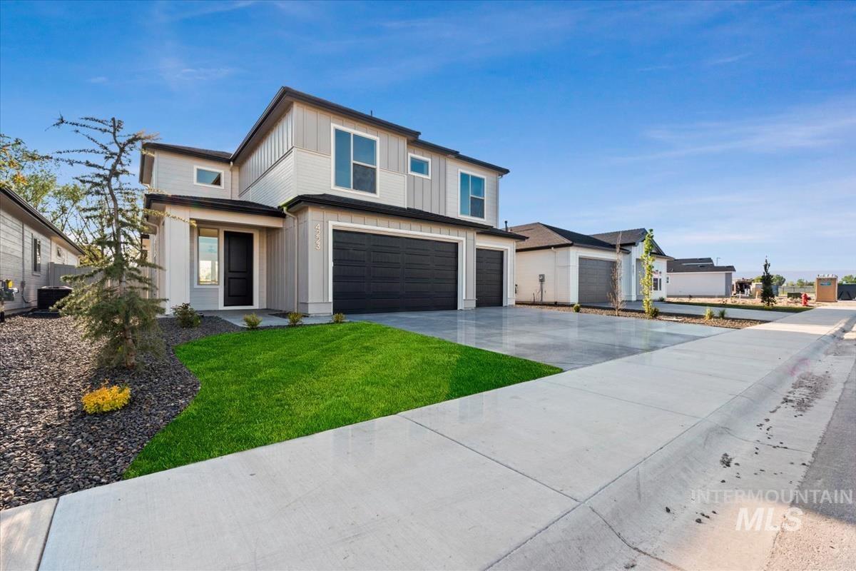 4223 Tropic Way Caldwell, ID 83607 - Photo 2 of 42 Contemporary two-story exterior with light gray siding and dark trim