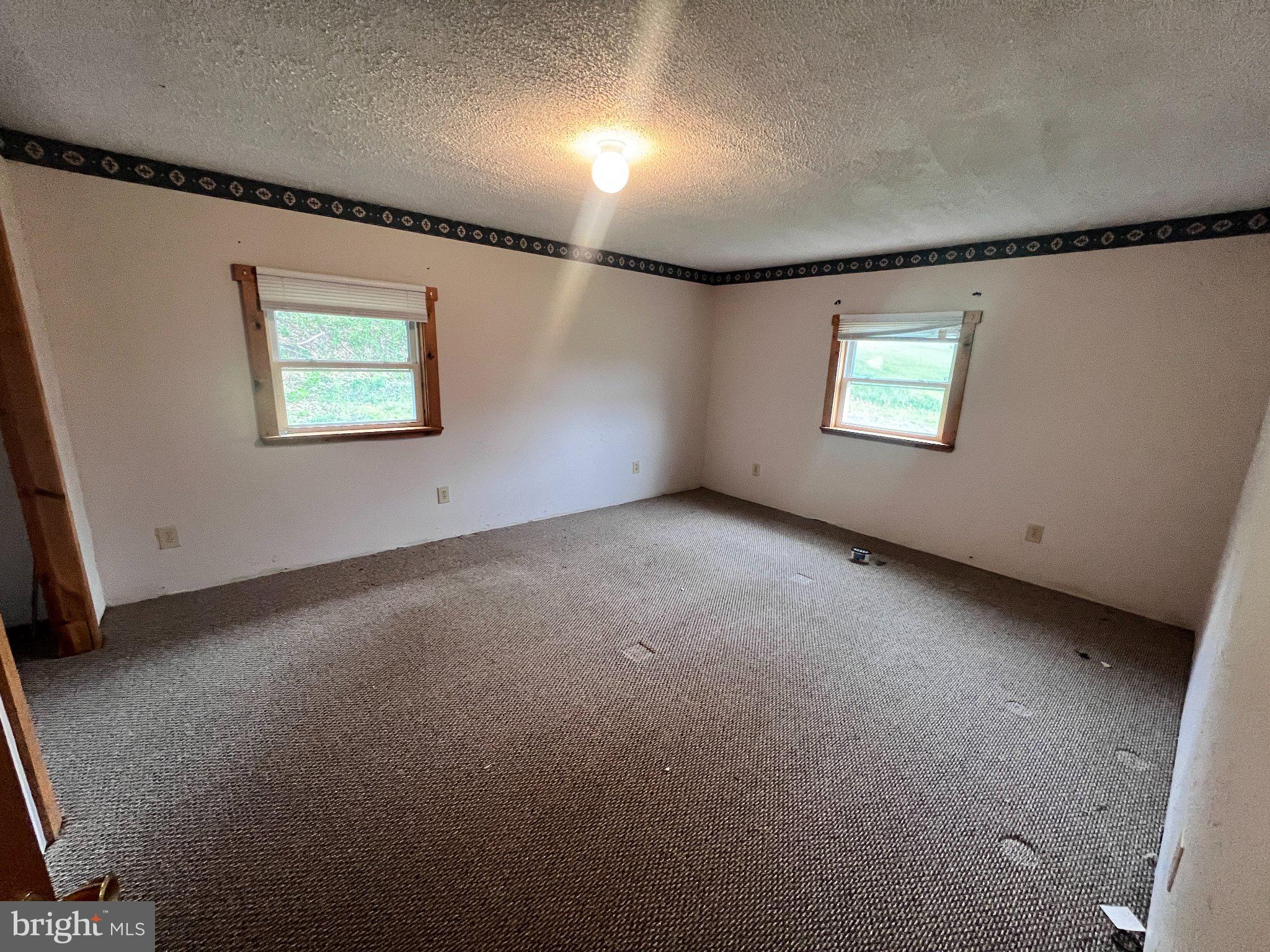 5151 Hutton Road Oakland, MD 21550 - Photo 13 of 32 a view of an empty room with a window