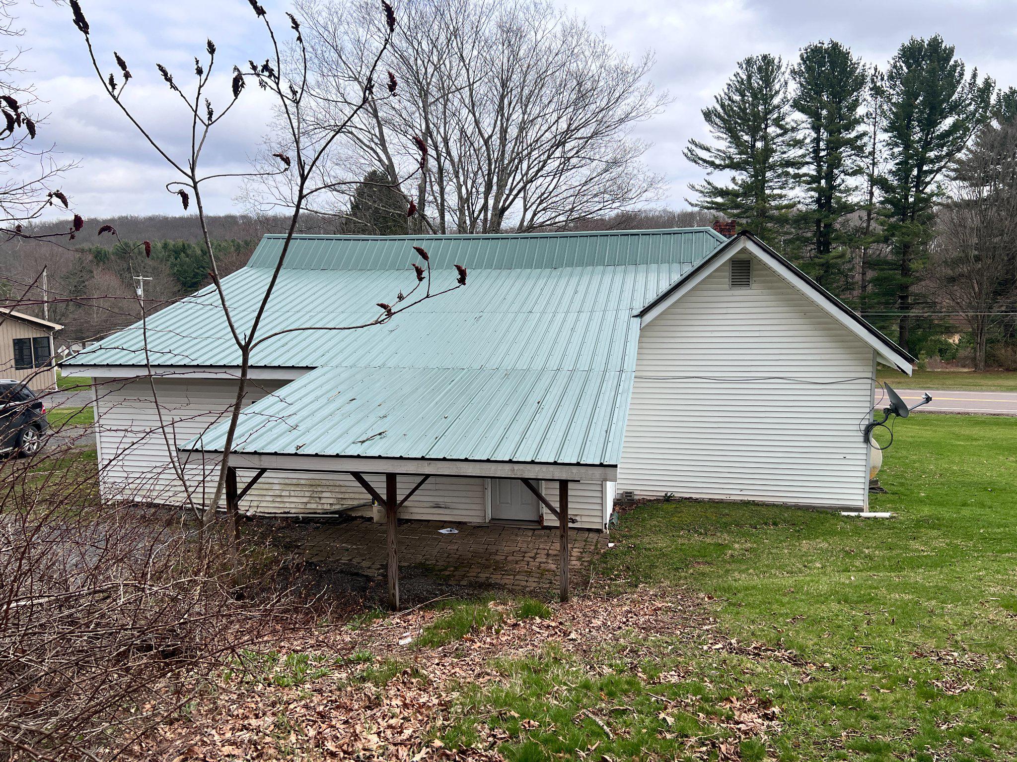 5151 Hutton Road Oakland, MD 21550 - Photo 21 of 32 a view of backyard with wooden fence and a bench