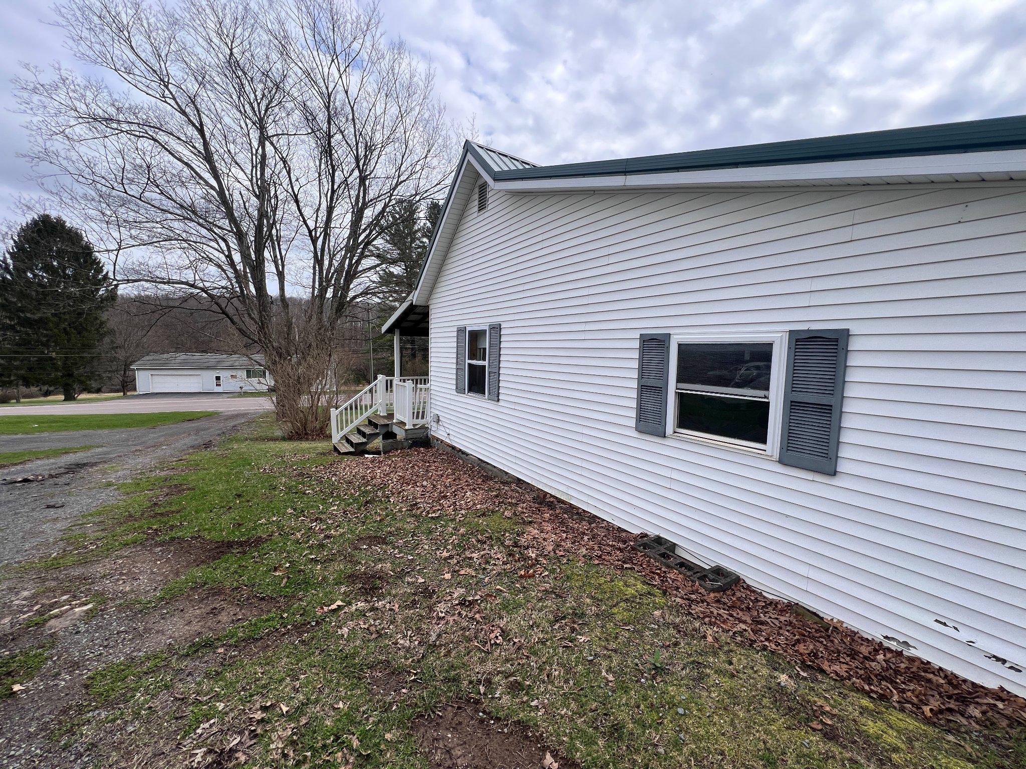 5151 Hutton Road Oakland, MD 21550 - Photo 25 of 32 a view of a house with a yard