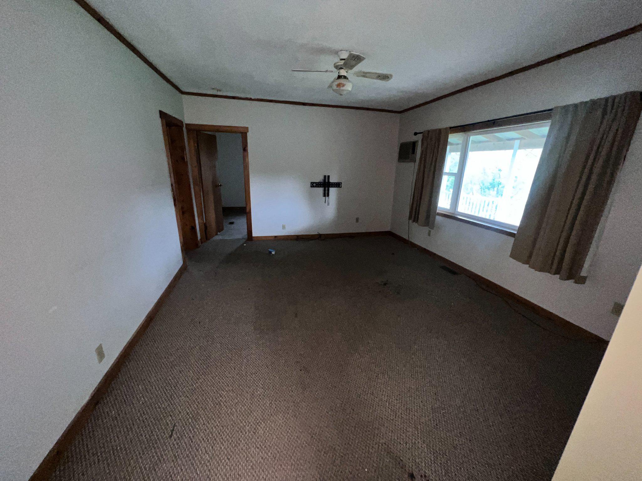 5151 Hutton Road Oakland, MD 21550 - Photo 6 of 32 a view of a livingroom with an empty space and a window