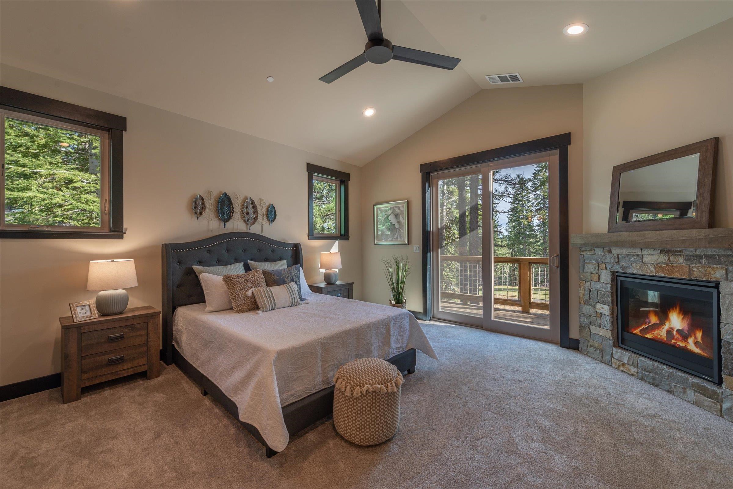 13510 Ski View Loop Truckee, CA 96161 - Photo 14 of 20 a bedroom with a bed and a fireplace
