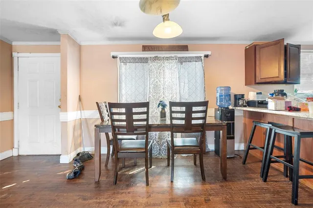 a kitchen with a sink a counter top space cabinets and stainless steel appliances