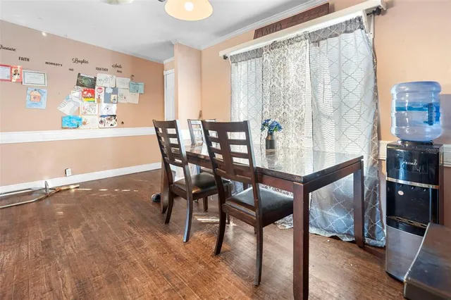 a large kitchen with stainless steel appliances granite countertop a stove top oven a sink dishwasher and white cabinets