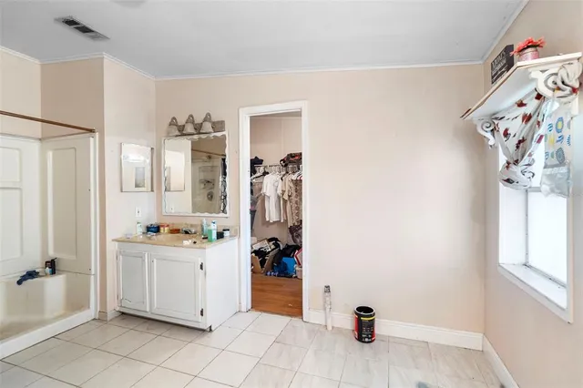 a view of a storage and utility room with closet