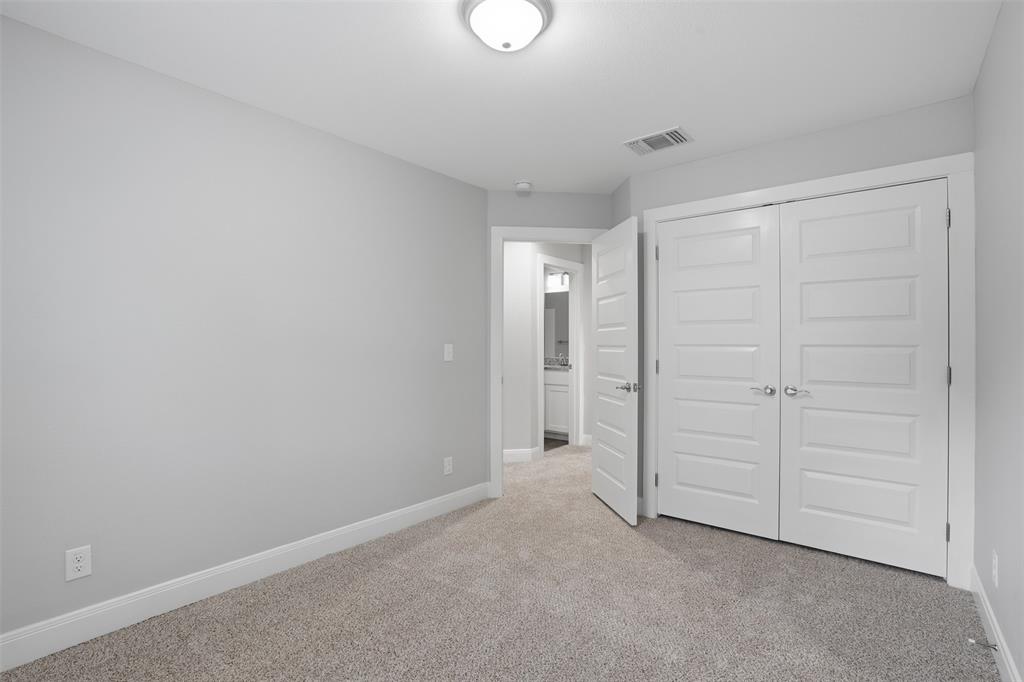 1022 West Shepherd Street, Unit 1022 Denison, TX 75020 - Photo 18 of 27 an empty room with closet area