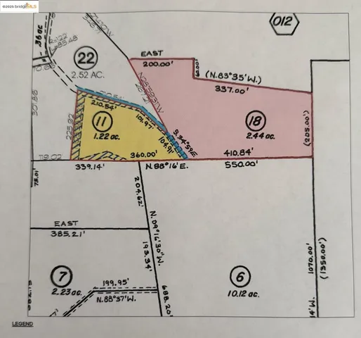 a view of a tree with a yard