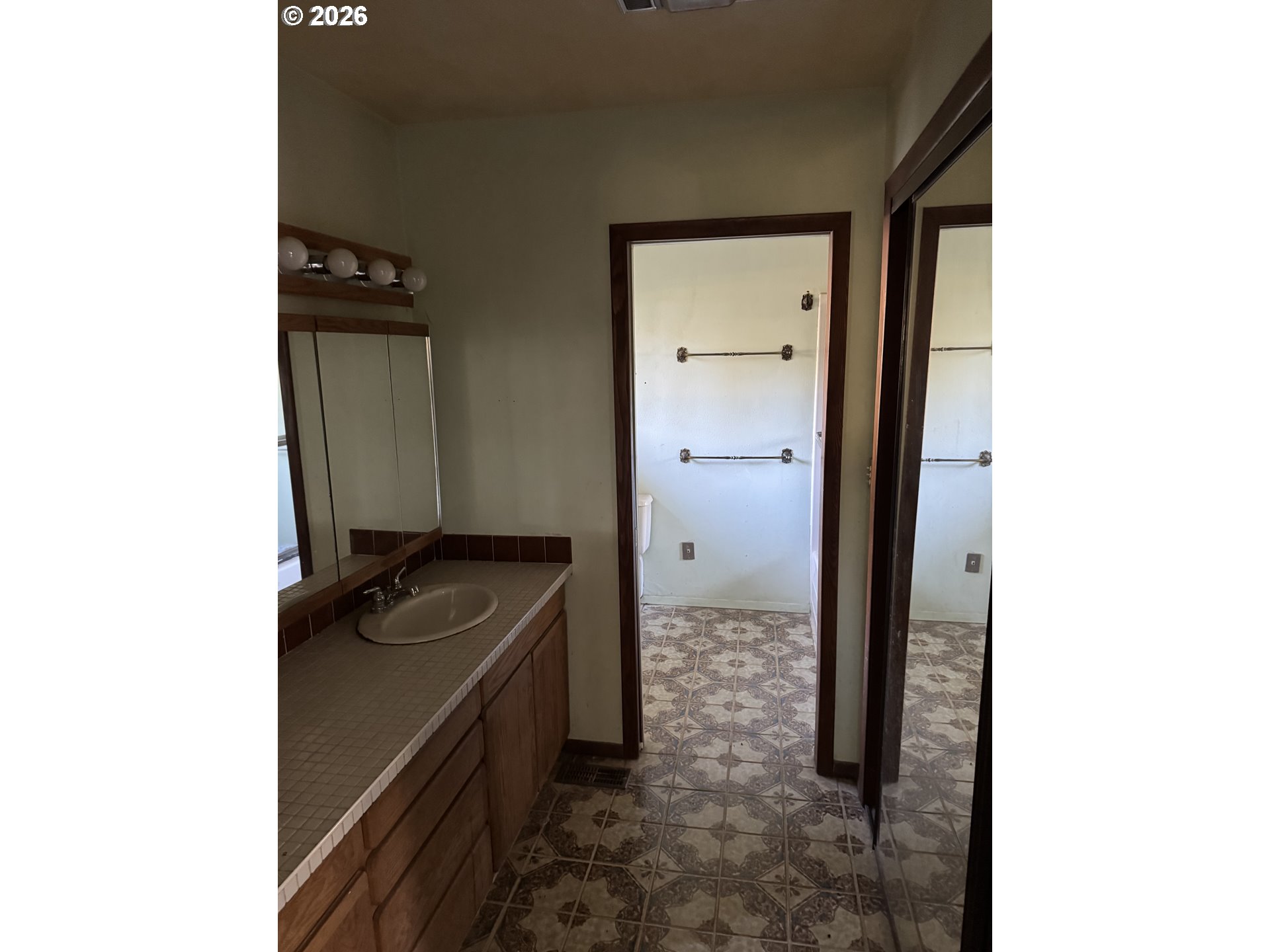 19105 Rock Creek Road Sheridan, OR 97378 - Photo 22 of 27 a bathroom with a sink and a mirror