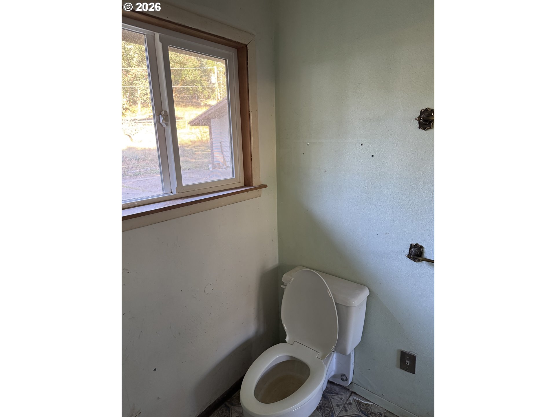 19105 Rock Creek Road Sheridan, OR 97378 - Photo 24 of 27 a bathroom with a toilet and a sink