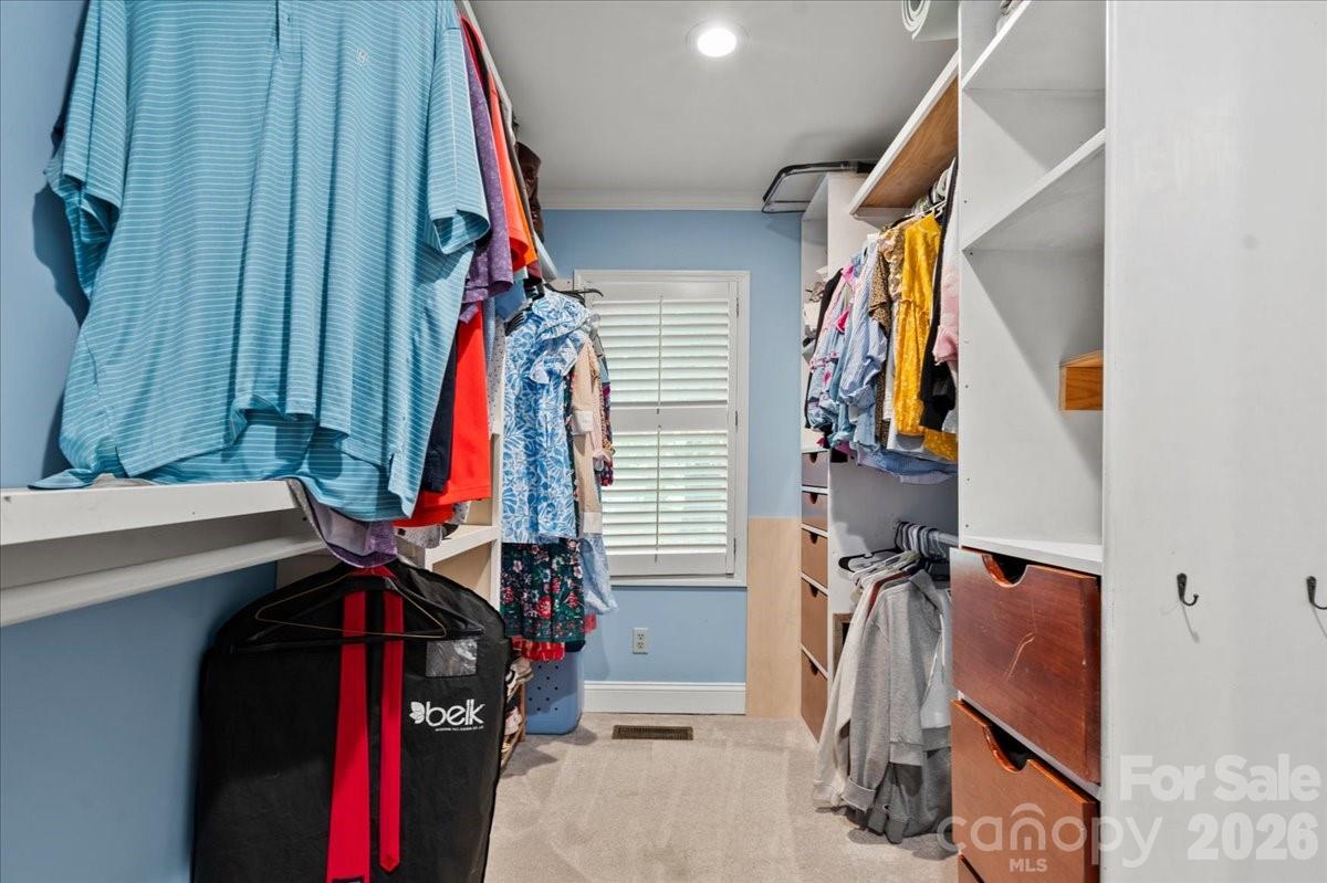 209 Fairway Road Cheraw, SC 29520 - Photo 14 of 48 a view of walk in closet with clothes