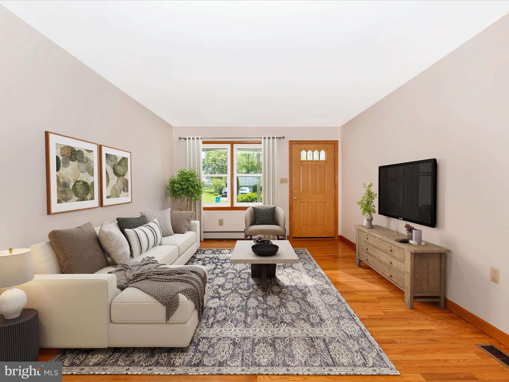 9203 Oak Tree Circle Frederick, MD 21701 - Photo 13 of 49 a living room with furniture and a flat screen tv