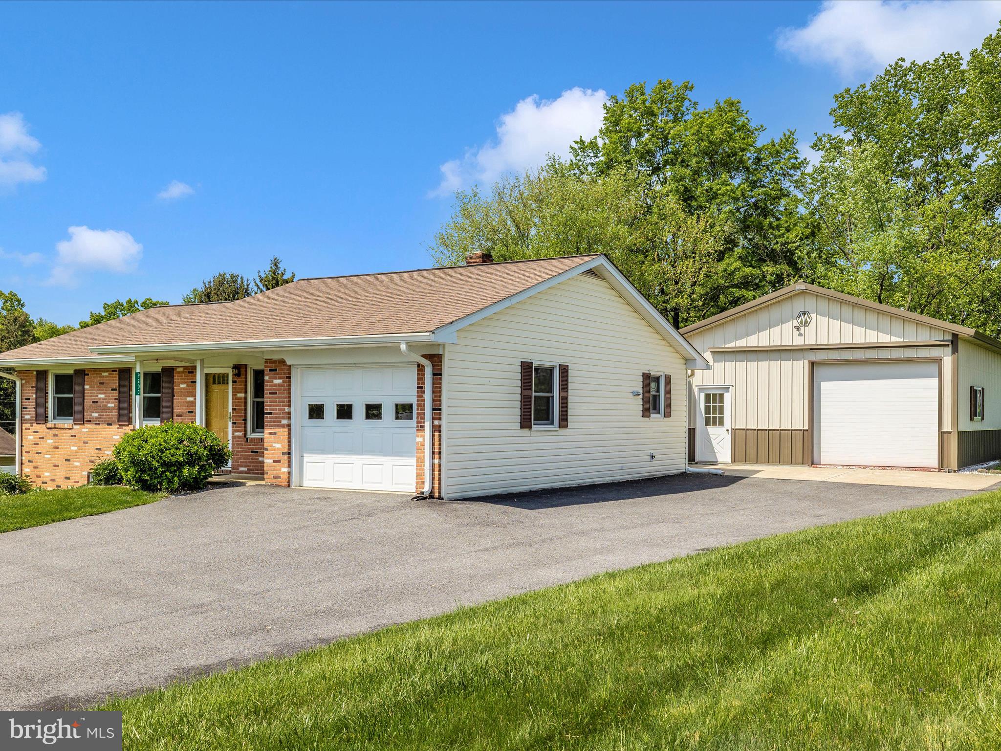 9203 Oak Tree Circle Frederick, MD 21701 - Photo 2 of 49 a view of a house with a yard and potted plants