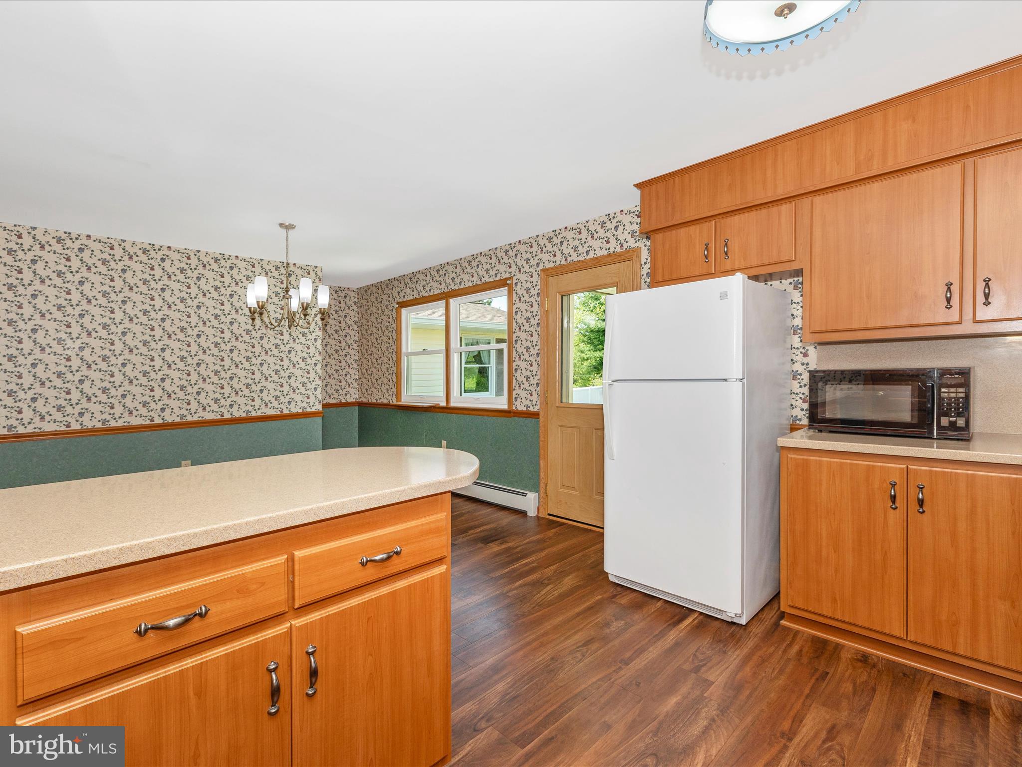 9203 Oak Tree Circle Frederick, MD 21701 - Photo 24 of 49 a kitchen with a refrigerator and a stove top oven