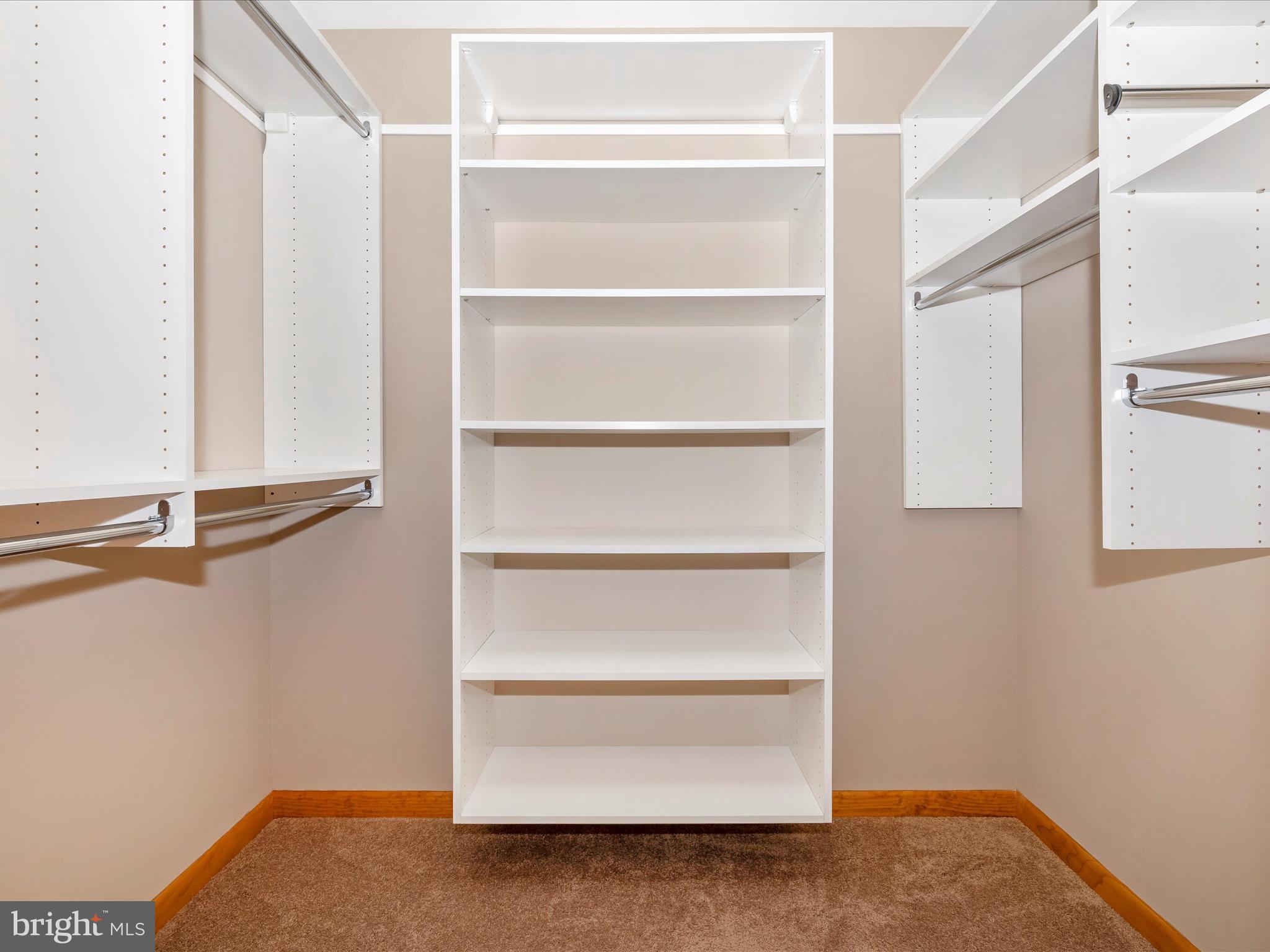 9203 Oak Tree Circle Frederick, MD 21701 - Photo 33 of 49 a view of walk in closet with empty racks