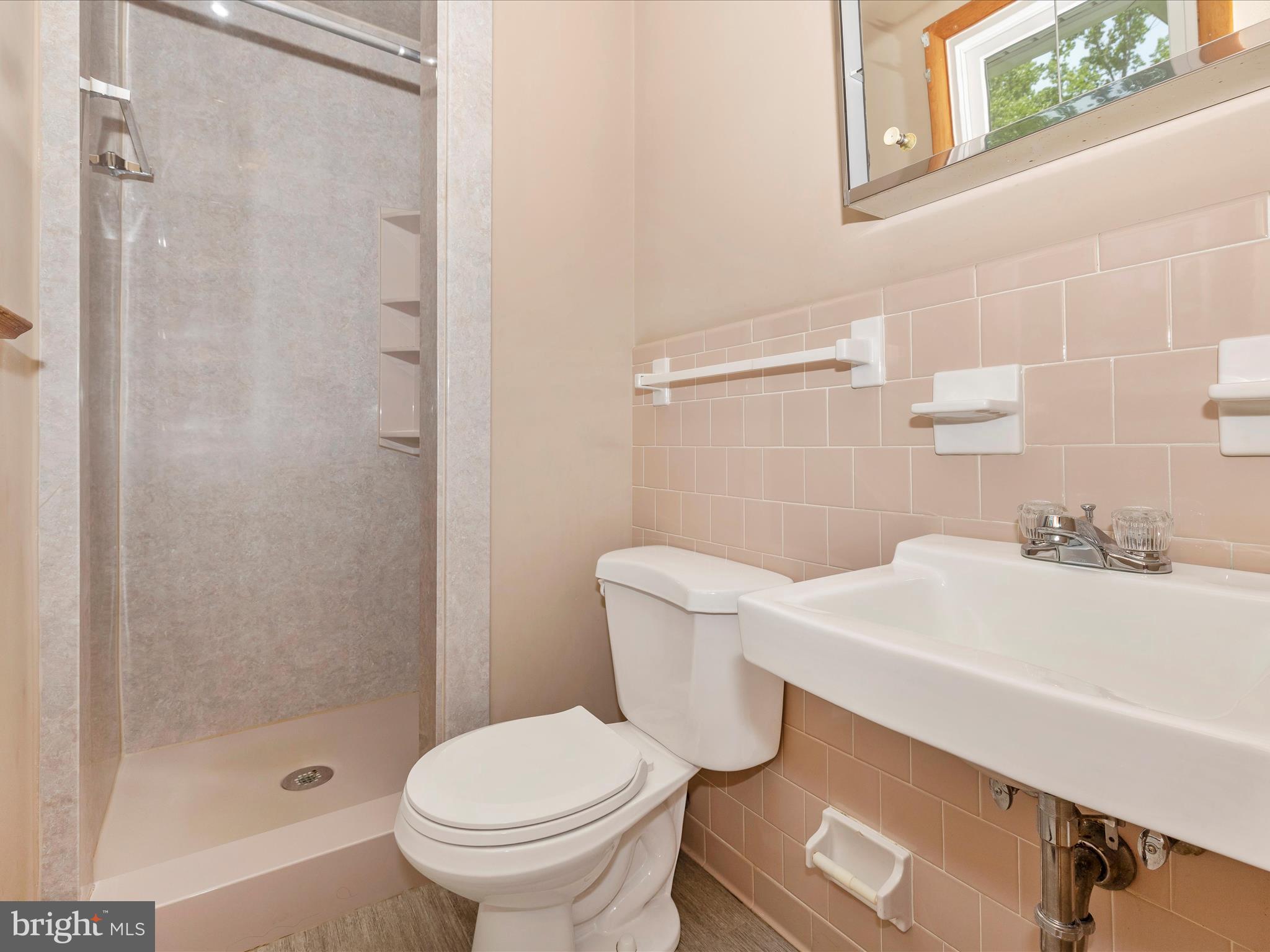 9203 Oak Tree Circle Frederick, MD 21701 - Photo 35 of 49 a bathroom with a sink a toilet and shower