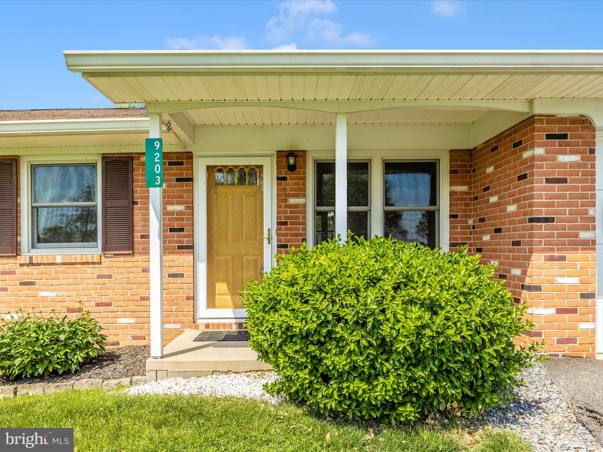 9203 Oak Tree Circle Frederick, MD 21701 - Photo 4 of 49 front view of a brick house with a large window