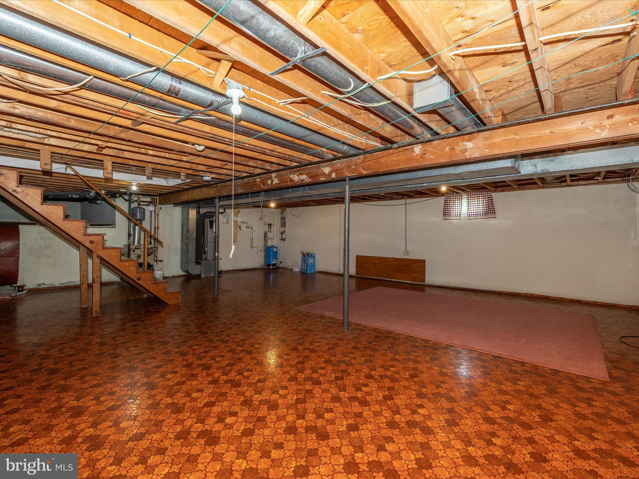 9203 Oak Tree Circle Frederick, MD 21701 - Photo 46 of 49 a view of a room with wooden roof and stairs