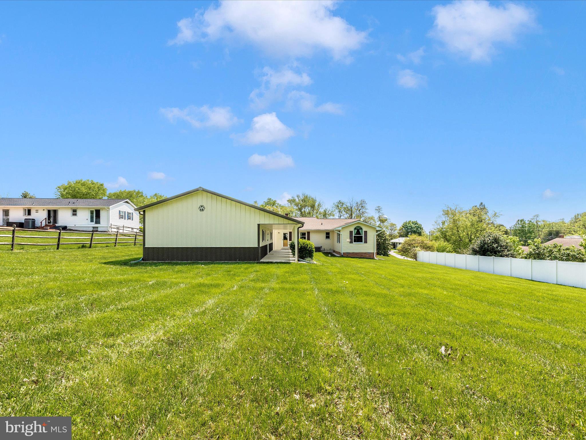 9203 Oak Tree Circle Frederick, MD 21701 - Photo 49 of 49 a front view of a house with garden
