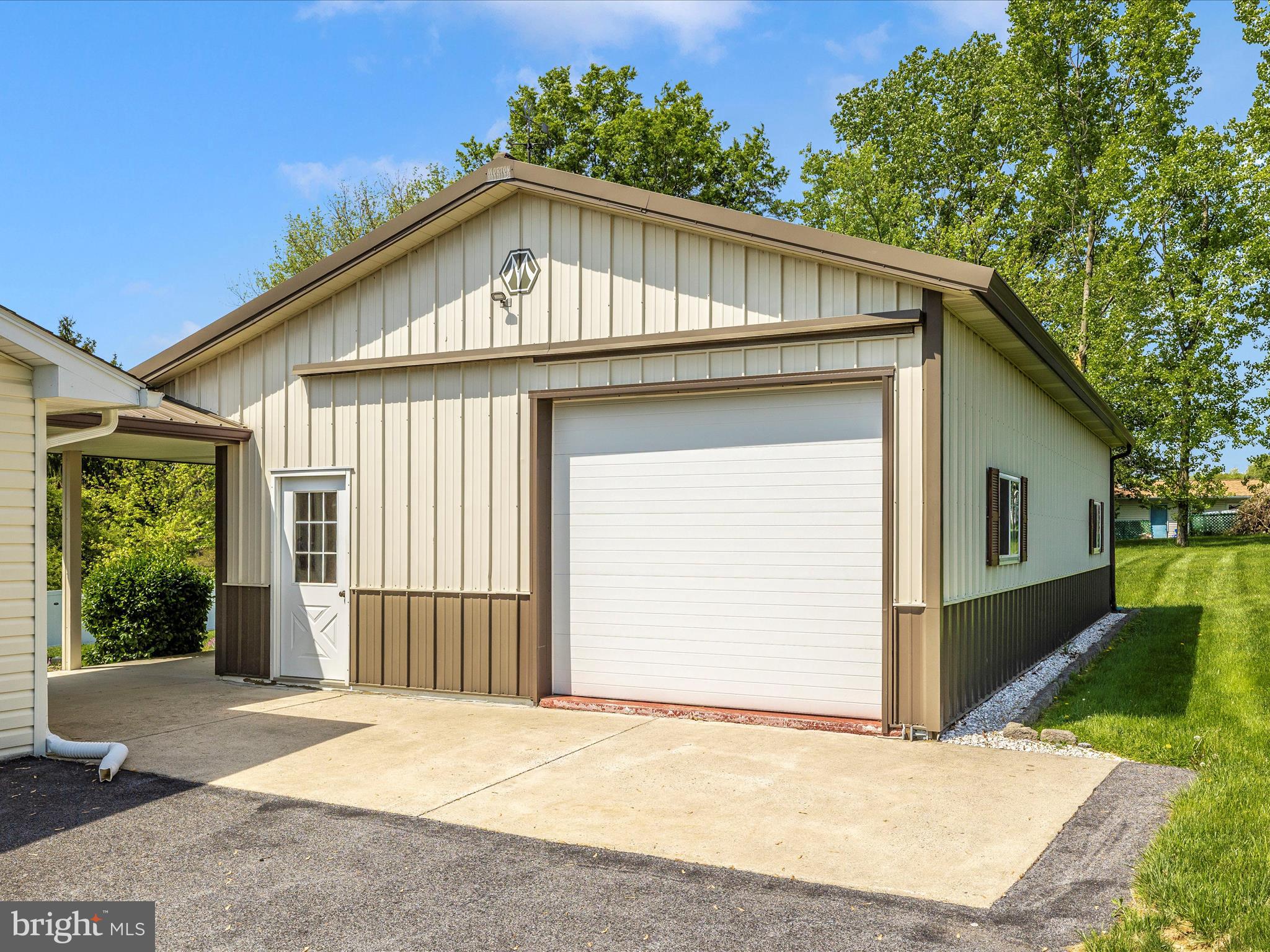 9203 Oak Tree Circle Frederick, MD 21701 - Photo 5 of 49 a front view of a house with a yard