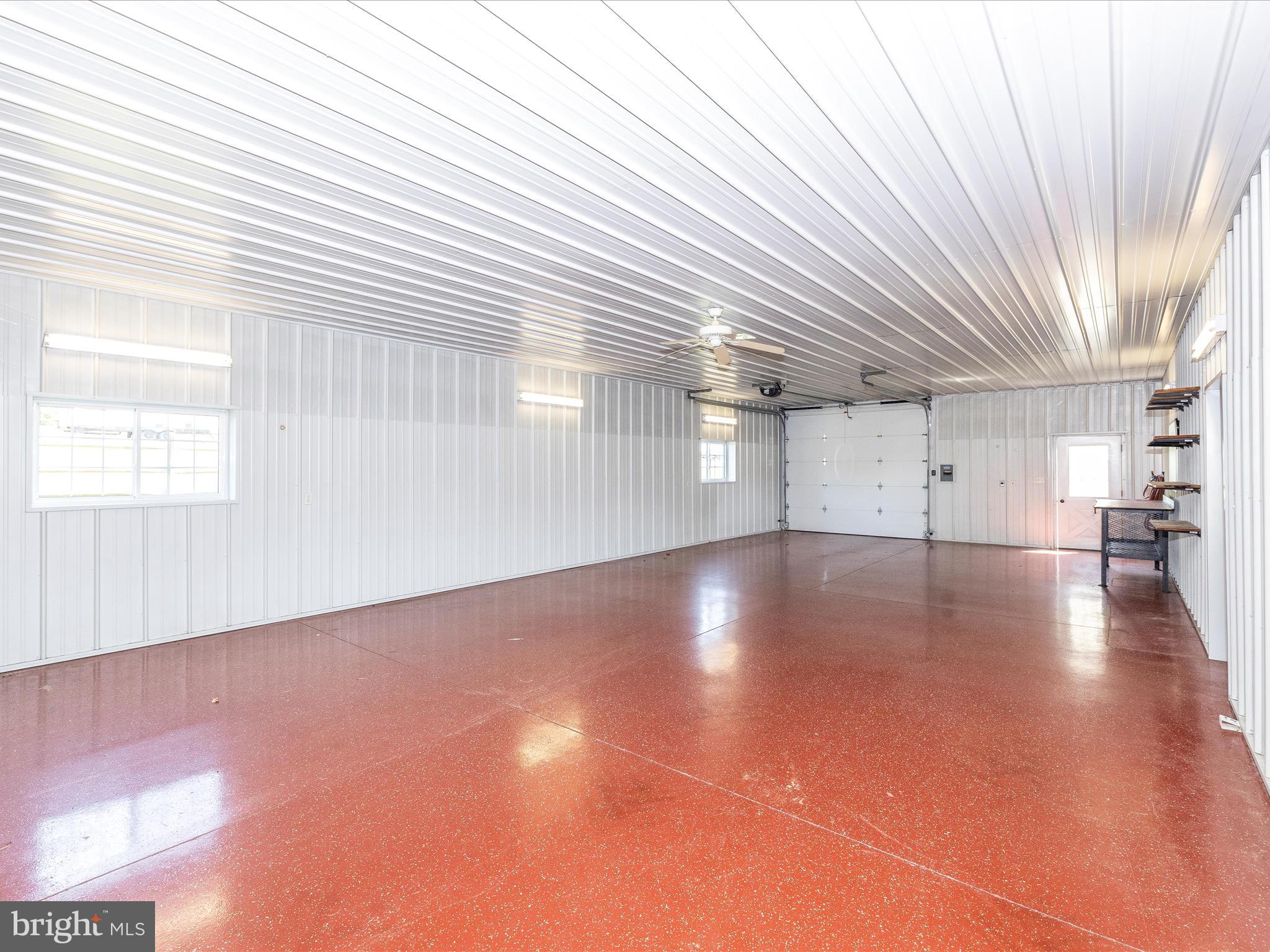 9203 Oak Tree Circle Frederick, MD 21701 - Photo 9 of 49 an empty room with wooden floor and windows