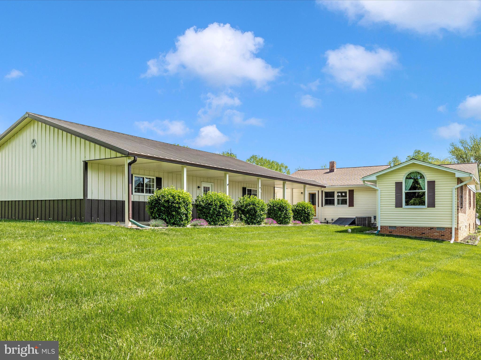 9203 Oak Tree Circle Frederick, MD 21701 - Photo 10 of 49 a front view of a house with a yard