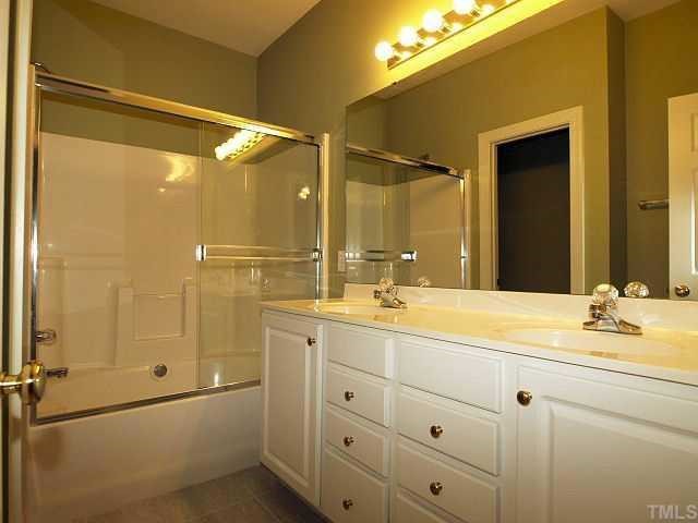 8714 Compass Lane Raleigh, NC 27615 - Photo 10 of 12 Master Bath w/ Dual Sink Vanity - Seperate Water Closet - Garden Tub w/ Shower and Shower Door. Good Size Master Closet is in the Master Bedroom.