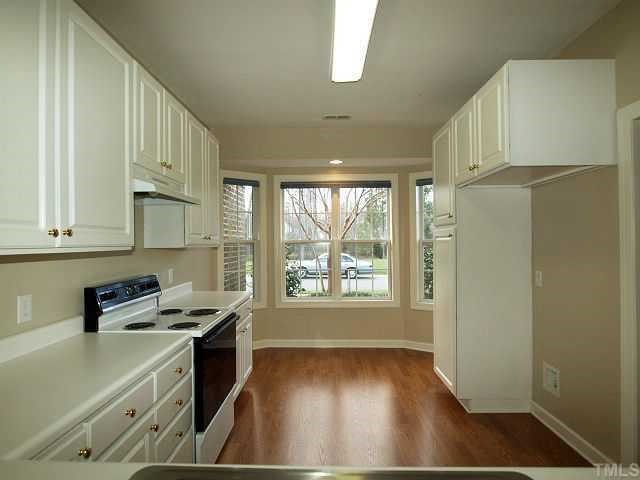 8714 Compass Lane Raleigh, NC 27615 - Photo 3 of 12 Kitchen w/Bayed Window Area is Great Location for a Cafe Table -- Enjoy Morning Coffee. Lots of Counter and Cabinet Space in this Good Sized Kitchen/Breakfast Area.
