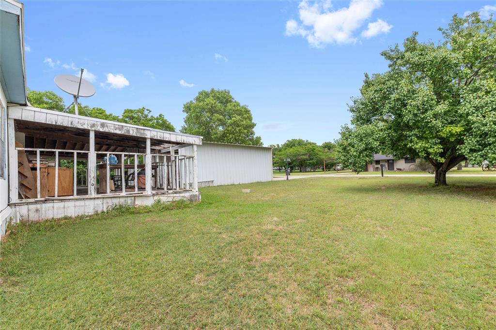 210 7th Street Blanket, TX 76432 - Photo 30 of 33 a view of an house with backyard space and balcony